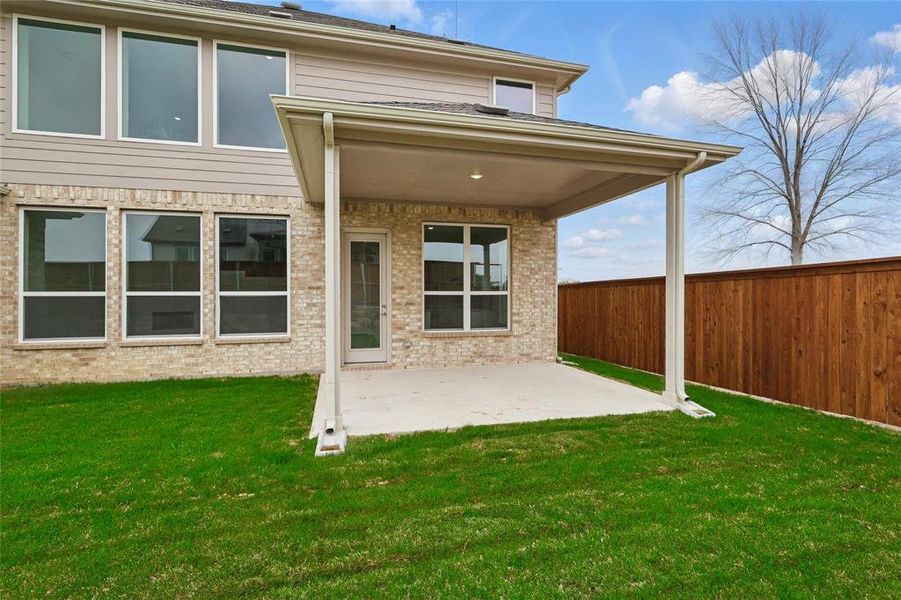 Back of property with a patio and brick siding Back of property with a patio and brick siding
