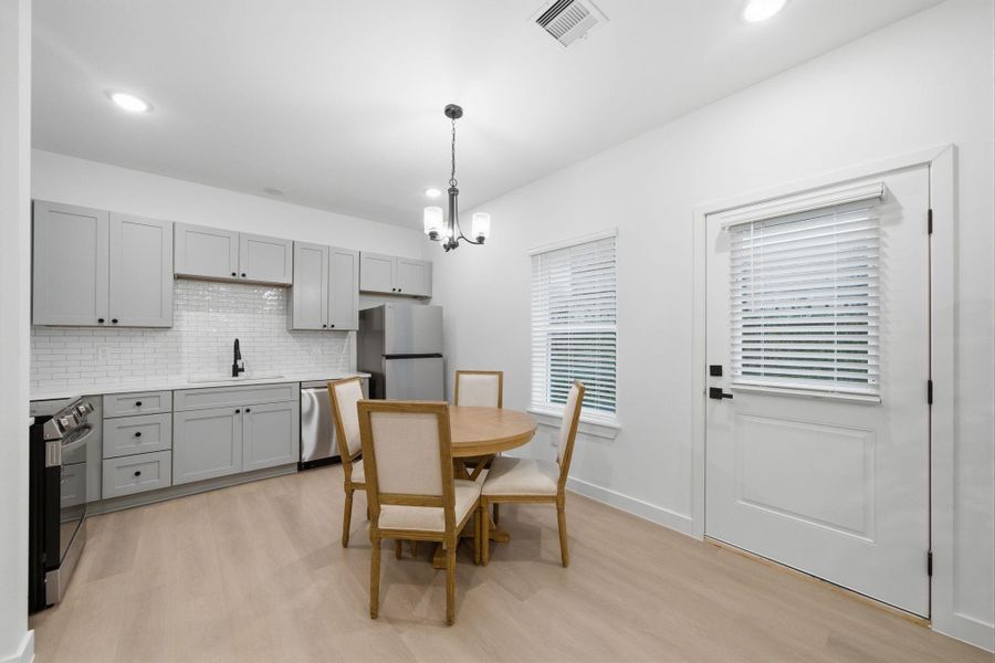 Access to back green space off the kitchen for grilling. Access to back green space off the kitchen for grilling.
