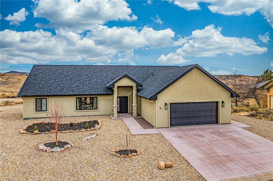 Front exterior of a new home in , Cañon City, CO, highlighting curb appeal (Image 22). Front exterior of a new home in , Cañon City, CO, highlighting curb appeal (Image 22).