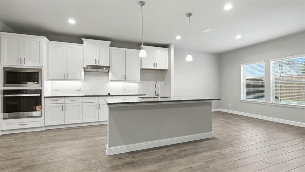 Kitchen - All Home and community information, including pricing, included features, terms, availability and amenities, are subject to change at any time without notice or obligation. All Drawings, pictures, photographs, video, square footages, floor plans, elevations, features, colors and sizes are approximate for illustration purposes only and will vary from the homes as built.