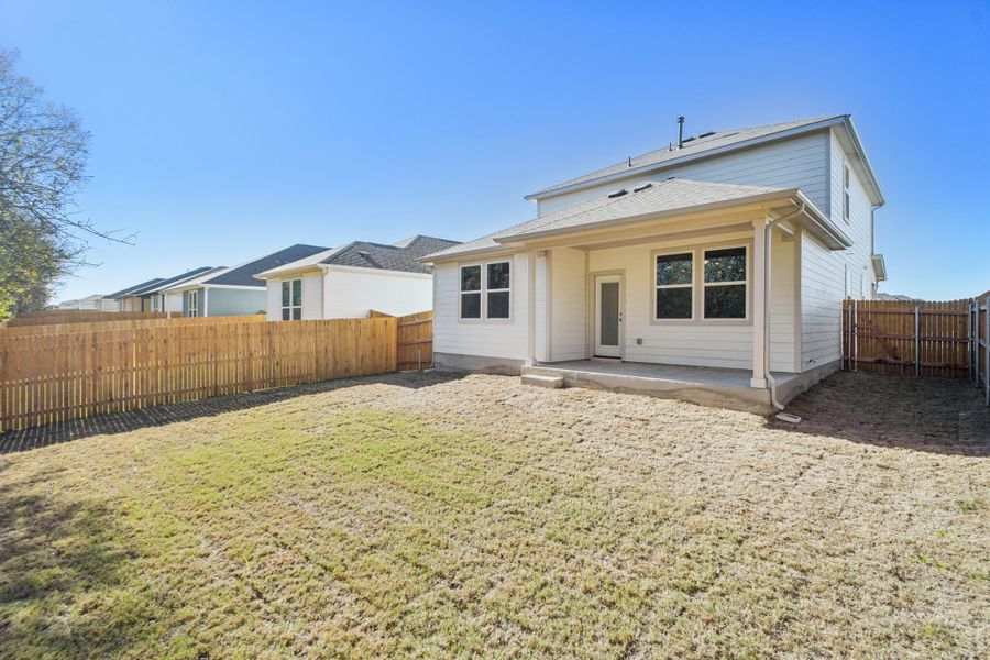 A house with a fence around it.
