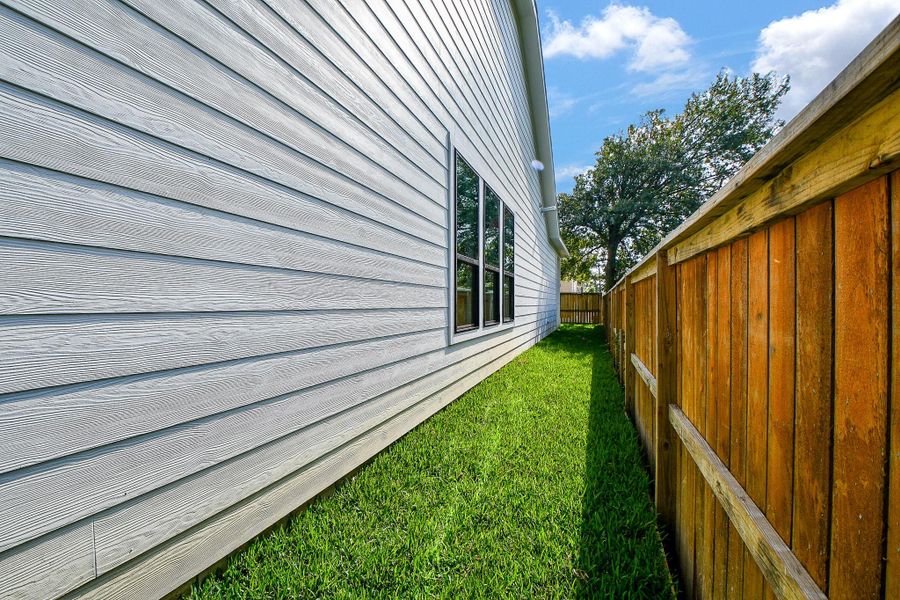 Exterior details and patio area of a home in , Houston (Image 4). Exterior details and patio area of a home in , Houston (Image 4).