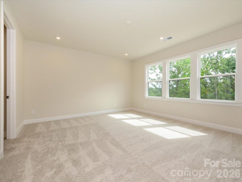 Light filled primary with tree lined views