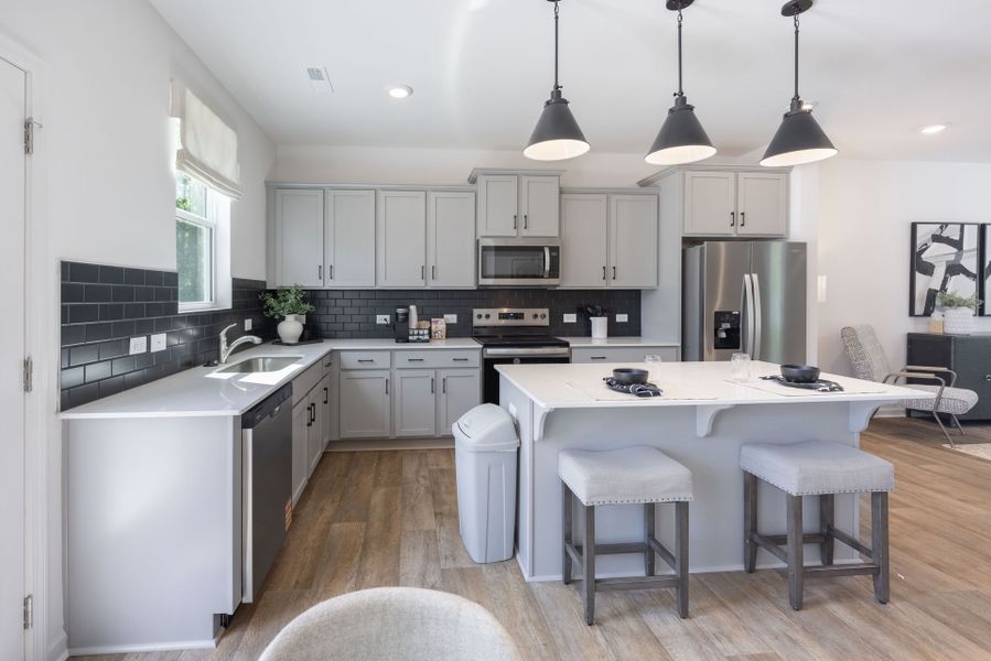 Furnished interior view inside a new home in Dukes Ridge, Charlotte (Image 1).