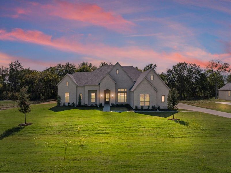 Front exterior of a new home in Waterfall Ranch - 1 Acre Lots, Waxahachie, TX, highlighting curb appeal (Image 15). Front exterior of a new home in Waterfall Ranch - 1 Acre Lots, Waxahachie, TX, highlighting curb appeal (Image 15).