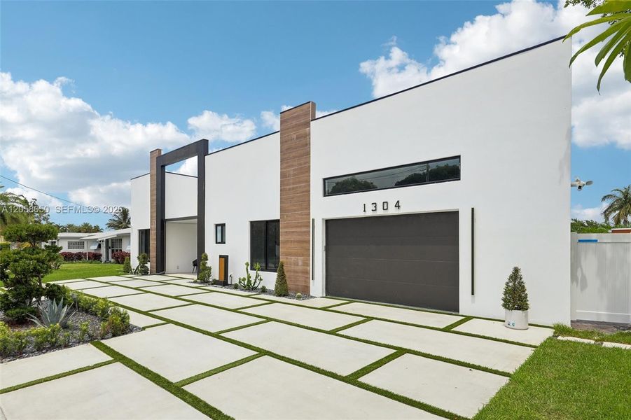 Front exterior of a new home in , Deerfield Beach, FL, highlighting curb appeal (Image 1). Front exterior of a new home in , Deerfield Beach, FL, highlighting curb appeal (Image 1).