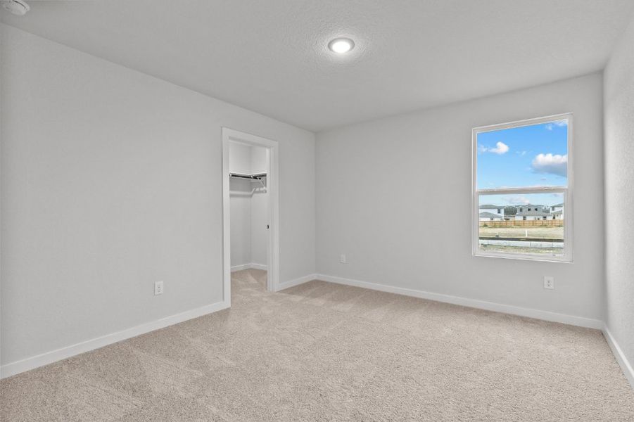 A room with a painting on the wall. A room with a painting on the wall.