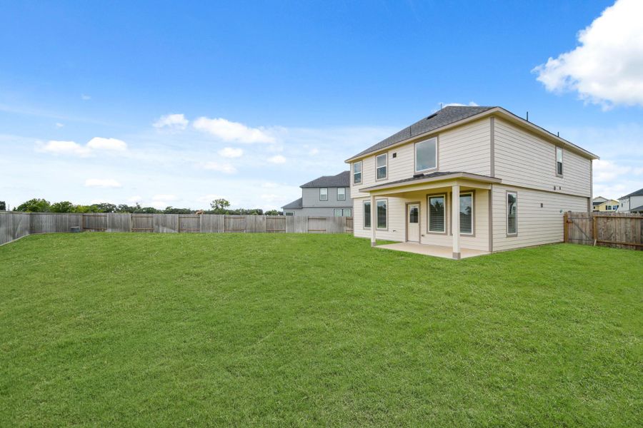 Front exterior of a new home in Grand Oaks Village, Houston, TX, highlighting curb appeal (Image 12). Front exterior of a new home in Grand Oaks Village, Houston, TX, highlighting curb appeal (Image 12).