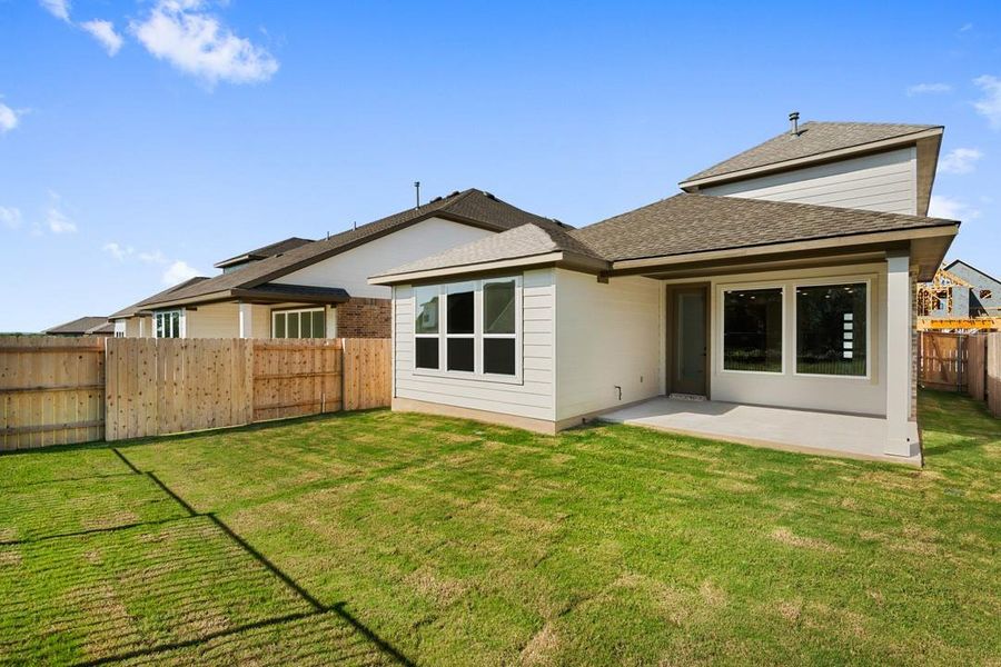 Front exterior of a new home in Terrace Collection at Lariat, Liberty Hill, TX, highlighting curb appeal (Image 2). Front exterior of a new home in Terrace Collection at Lariat, Liberty Hill, TX, highlighting curb appeal (Image 2).