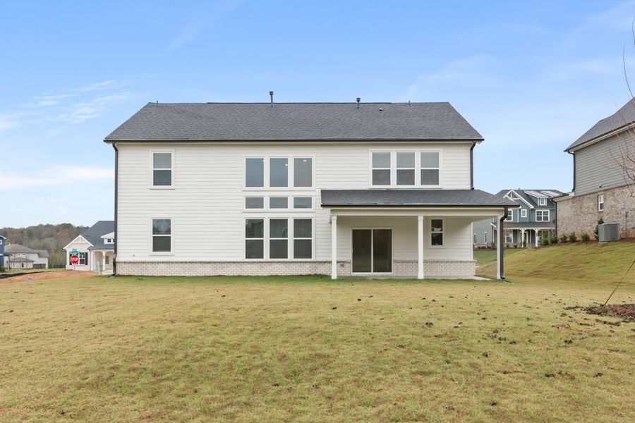 A house with a grass yard. A house with a grass yard.