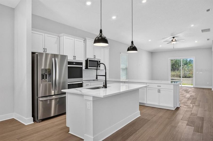 Furnished interior view inside a new home in Stables at Cary Forest, Bryceville (Image 7).