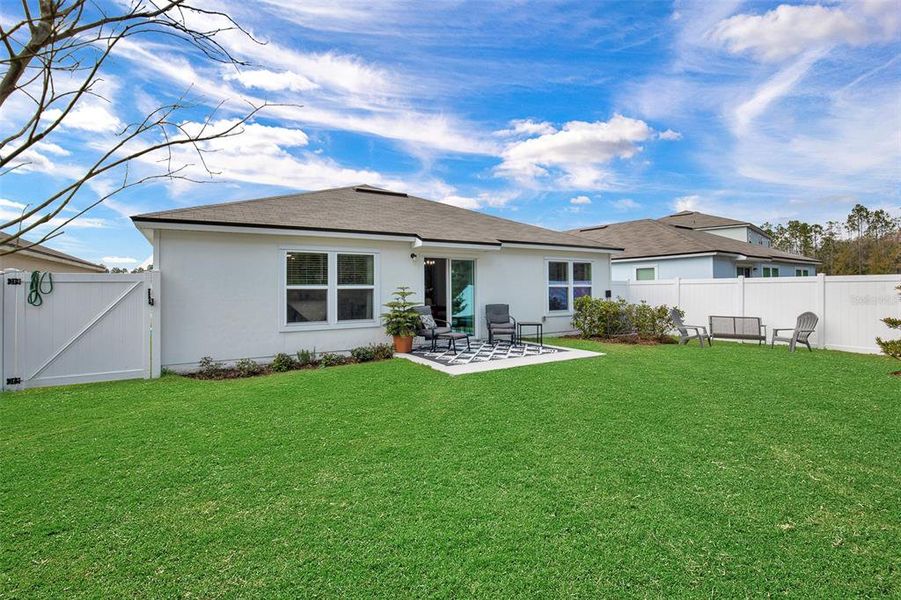 Exterior details and patio area of a home in Sawmill Branch, Palm Coast (Image 28).