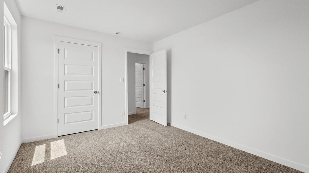 Representative unfurnished interior of a home built from the Holcombe by D.R. Horton in Peachtree Meadows, Rockwall (Image 25).