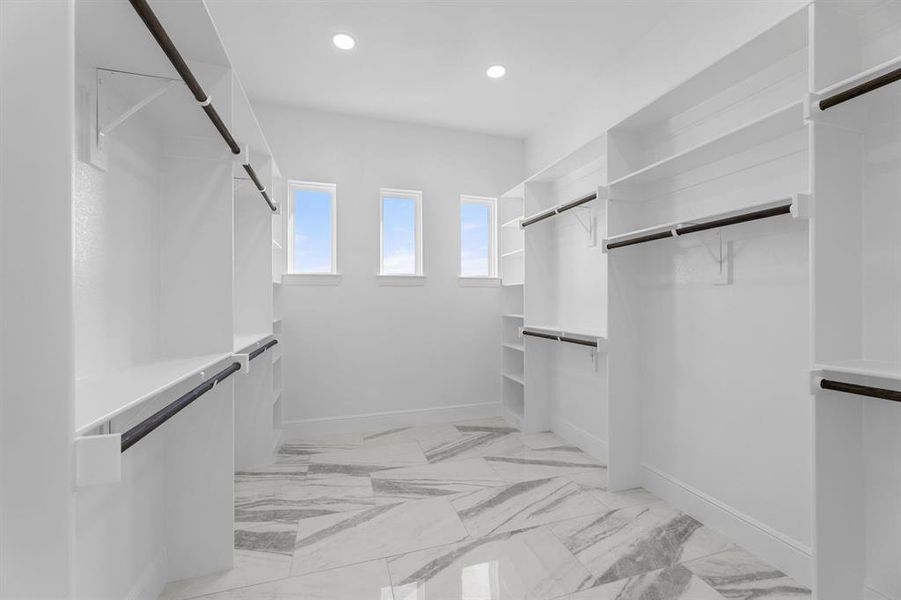 View of spacious master bedroom closet