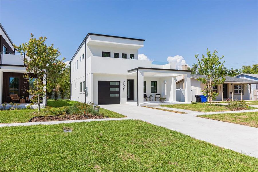 Front exterior of a new home in , St. Petersburg, FL, highlighting curb appeal (Image 27).