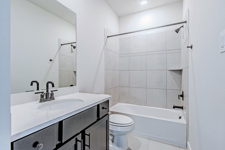 Full bathroom with modern fixtures and clean design.