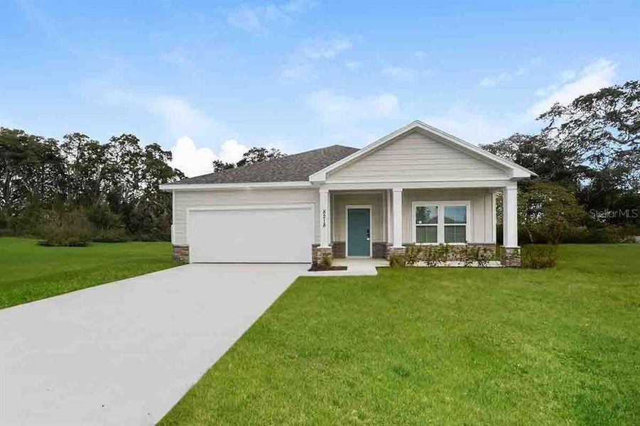 Front exterior of a new home in , North Port, FL, highlighting curb appeal (Image 1). Front exterior of a new home in , North Port, FL, highlighting curb appeal (Image 1).