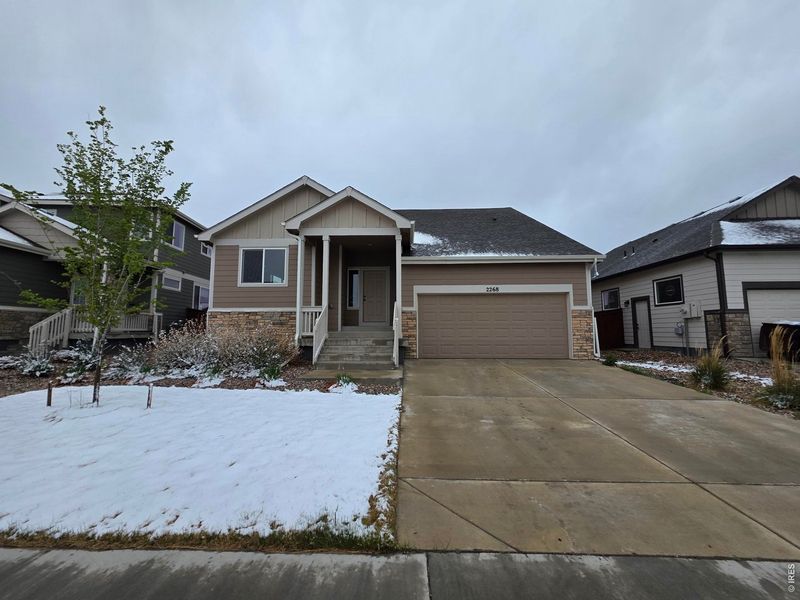 Front exterior of a new home in , Windsor, CO, highlighting curb appeal (Image 13).