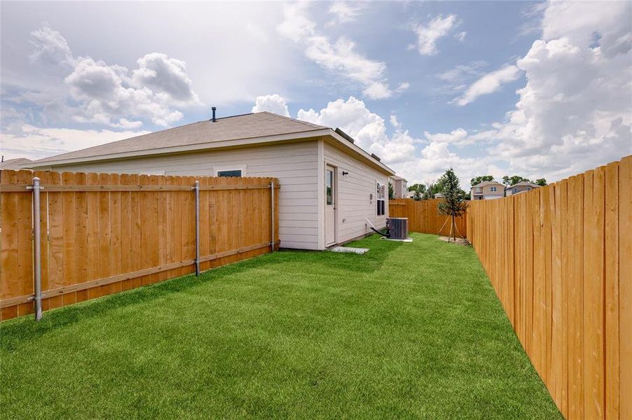 View of fenced backyard