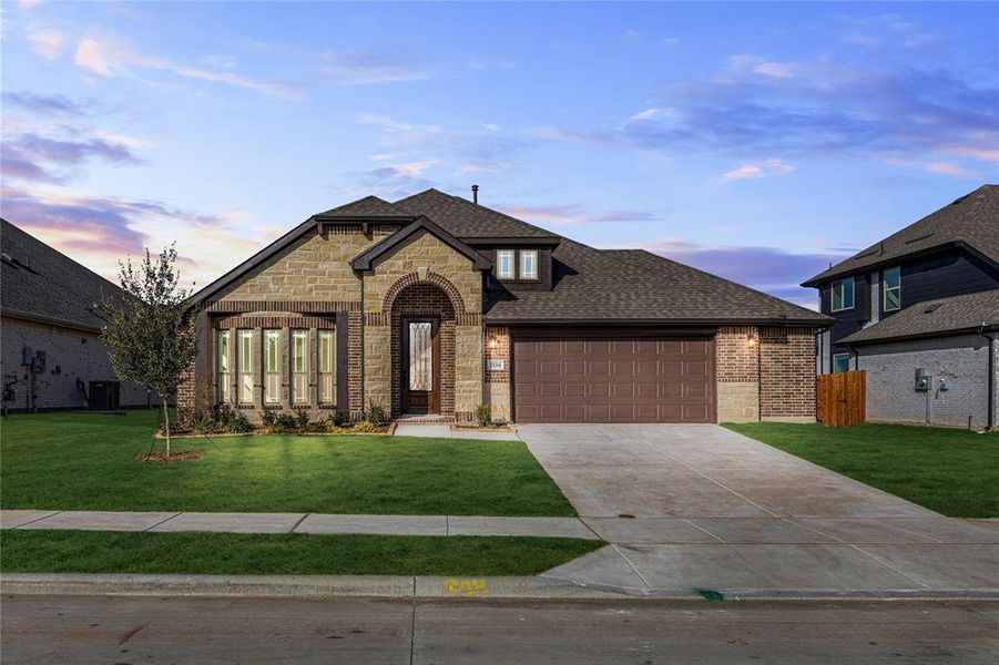Front exterior of a new home in West Crossing, Anna, TX, highlighting curb appeal (Image 25). Front exterior of a new home in West Crossing, Anna, TX, highlighting curb appeal (Image 25).