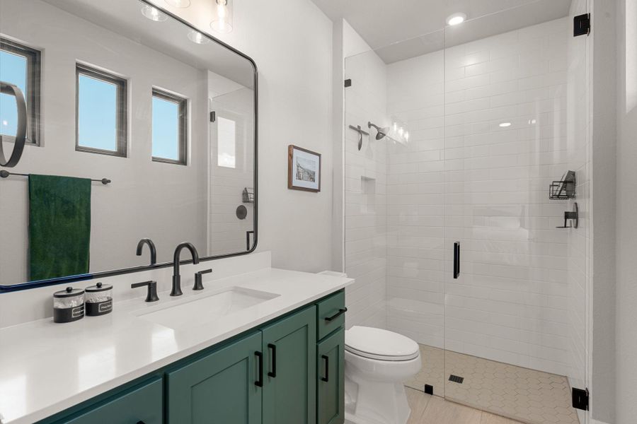 Clean lines and modern tilework define this beautifully updated master bathroom.