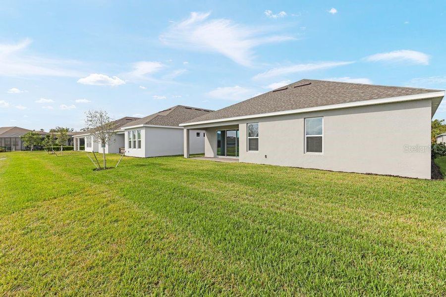Exterior details and patio area of a home in The Cove at West Port, Port Charlotte (Image 19).