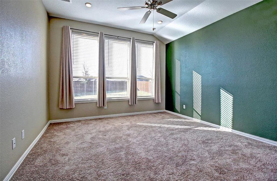 Primary Bedroom with large windows for natural light.