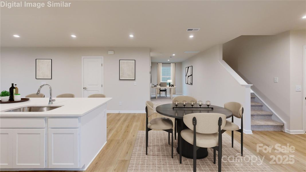 Versatile nook off the dining area - perfectly suited for a cozy reading retreat, a focused homework zone, or  charming space for your furry companion.