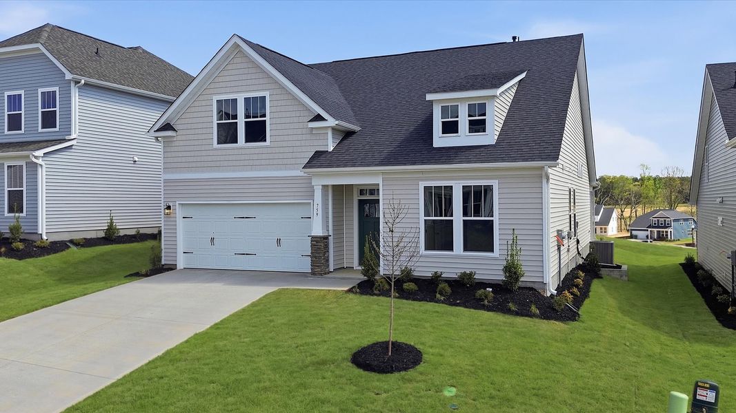 Front exterior of a new home in Iris Meadows, Moore, SC, highlighting curb appeal (Image 20).