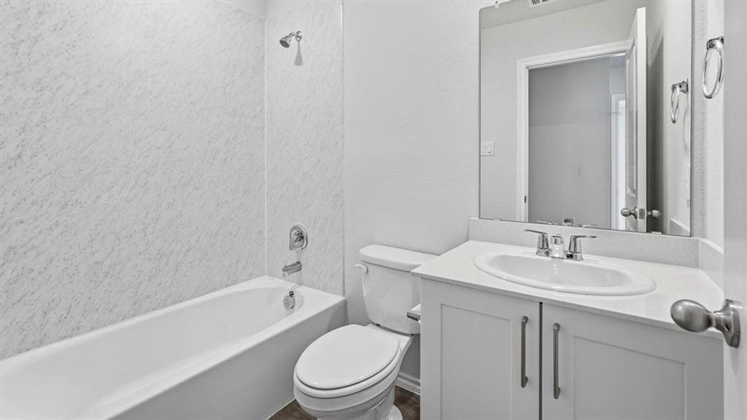 Full bathroom with vanity and washtub / shower combination
