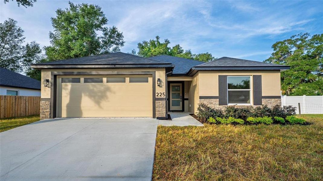 Front exterior of a new home in , Umatilla, FL, highlighting curb appeal (Image 32). Front exterior of a new home in , Umatilla, FL, highlighting curb appeal (Image 32).