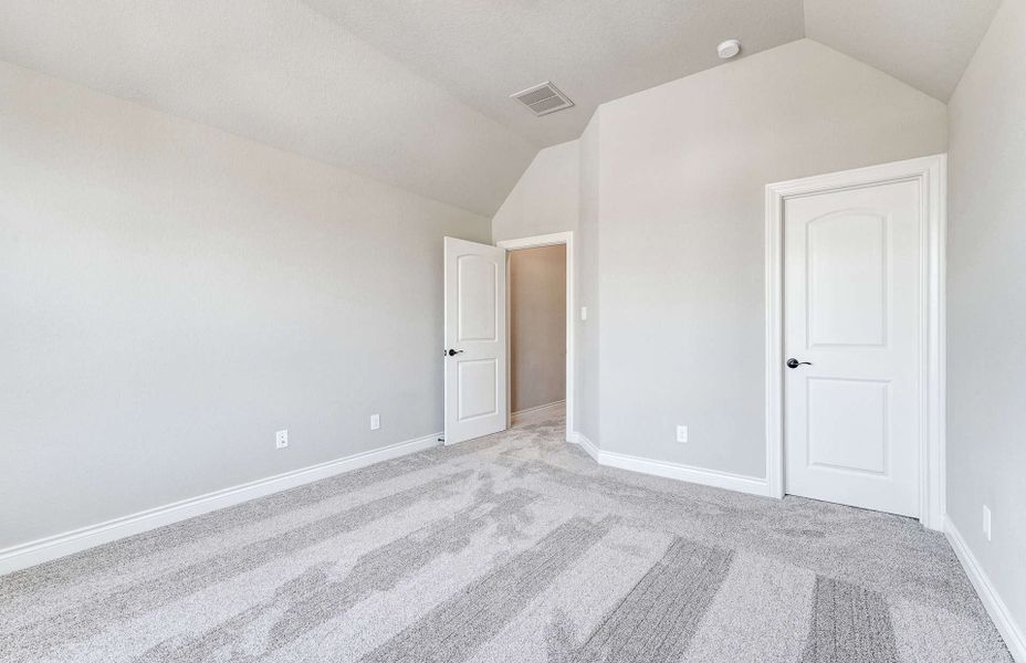 Representative unfurnished interior of a home built from the 4590 by Ravenna Homes in Artavia 70′, Conroe (Image 31).