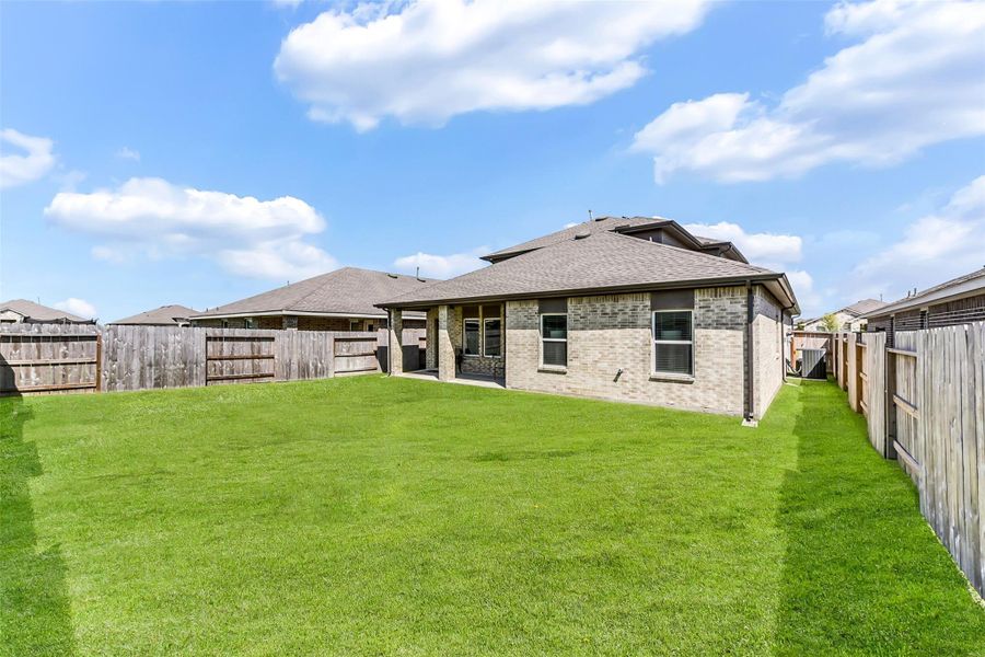 Exterior details and patio area of a home in Sunterra, Katy (Image 3). Exterior details and patio area of a home in Sunterra, Katy (Image 3).