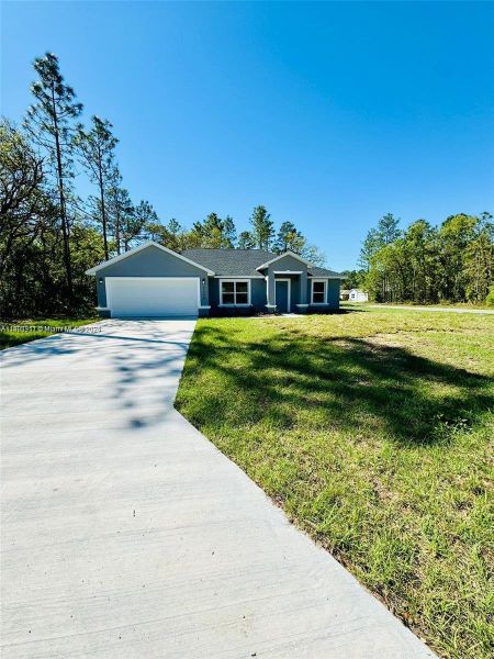 Front exterior of a new home in , Ocala, FL, highlighting curb appeal (Image 1). Front exterior of a new home in , Ocala, FL, highlighting curb appeal (Image 1).