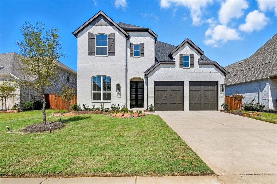 Front exterior of a new home in Star Trail: 55ft. lots, Prosper, TX, highlighting curb appeal (Image 2).