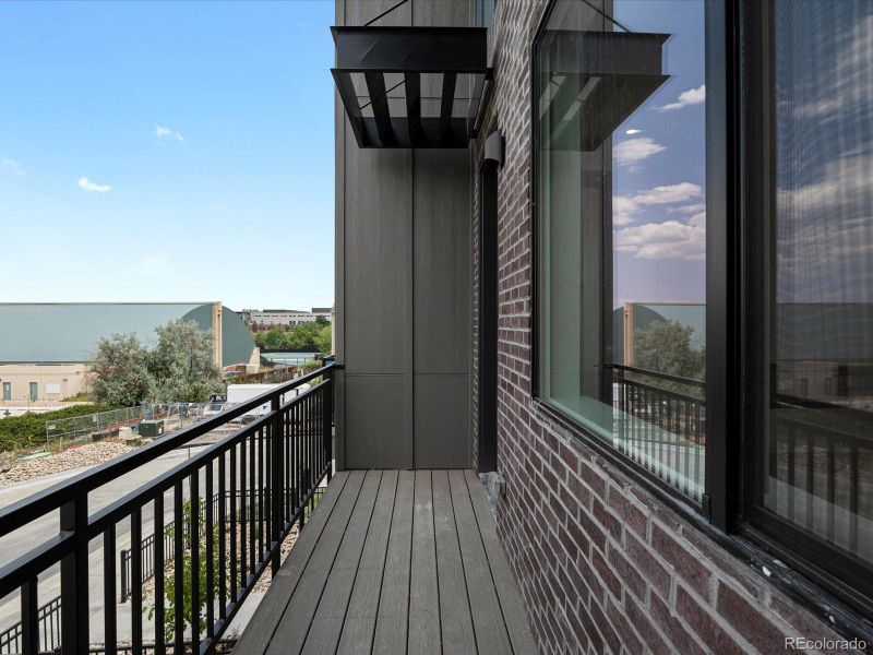 Exterior details and patio area of a home in Ascent at Inverness, Englewood (Image 1).