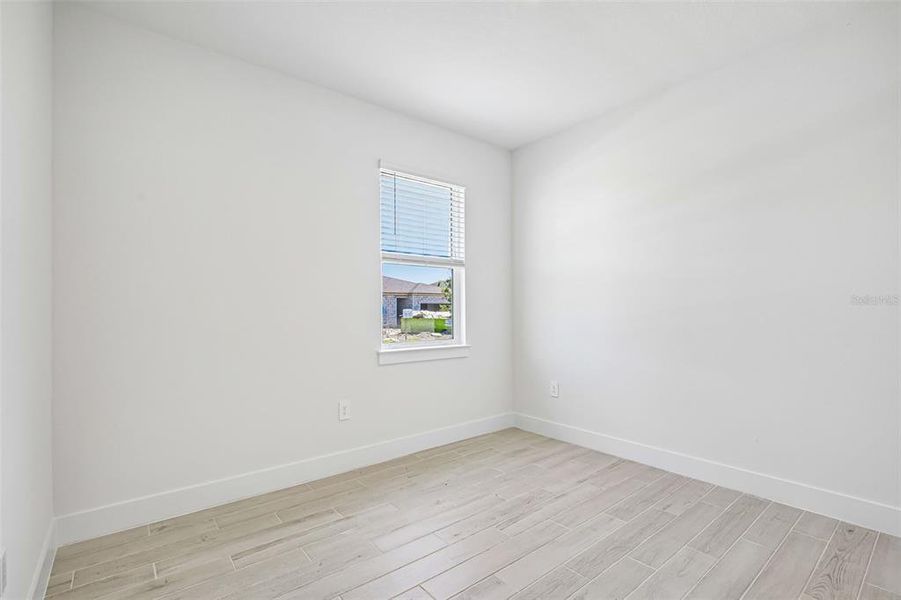 Spacious, unfurnished interior of a new home in Magnolia Bay - Reserve Series, Nokomis (Image 17).