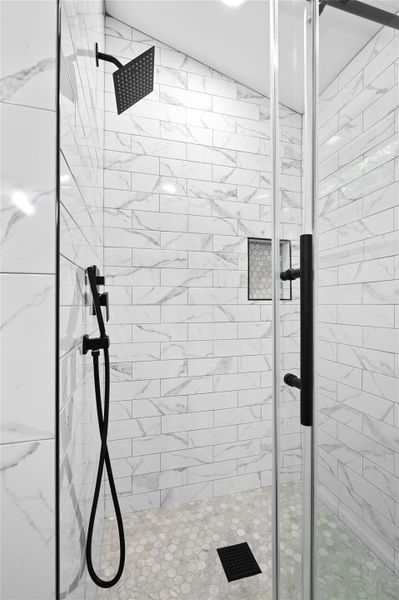 Full bathroom with a shower stall