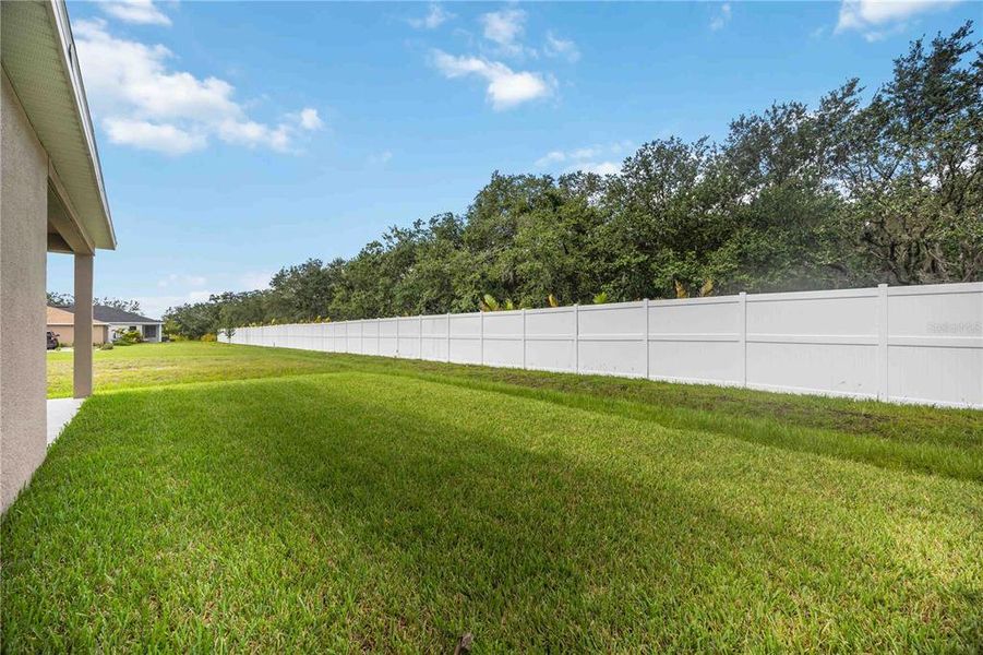 Front exterior of a new home in Creekside at Rutland Ranch, Parrish, FL, highlighting curb appeal (Image 1).