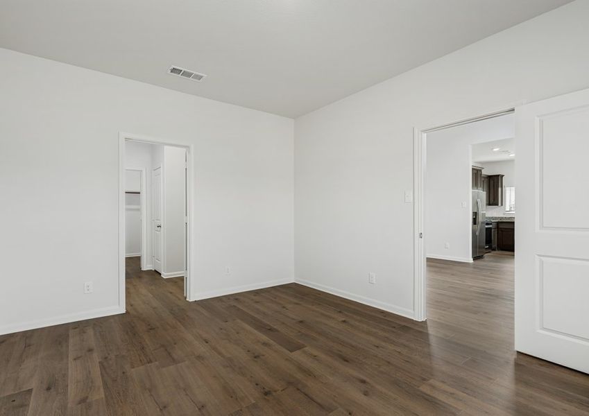 The master suite has a large bedroom, ensuite bathroom and a walk-in closet.