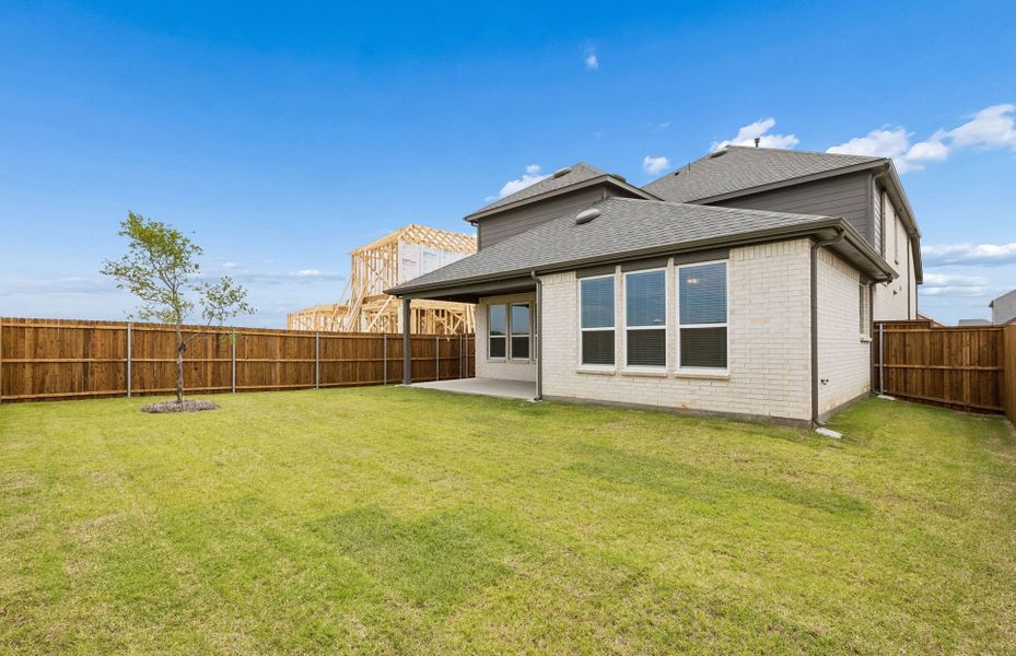 Exterior details and patio area of a home in Whitewing Trails, Princeton (Image 2).