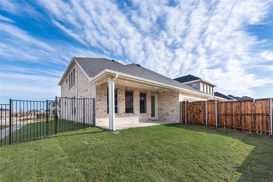 Exterior details and patio area of a home in Villages of Creekwood, Frisco (Image 23).