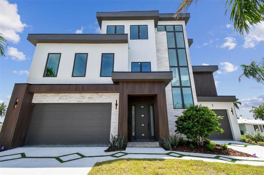 Front exterior of a new home in , Treasure Island, FL, highlighting curb appeal (Image 2). Front exterior of a new home in , Treasure Island, FL, highlighting curb appeal (Image 2).