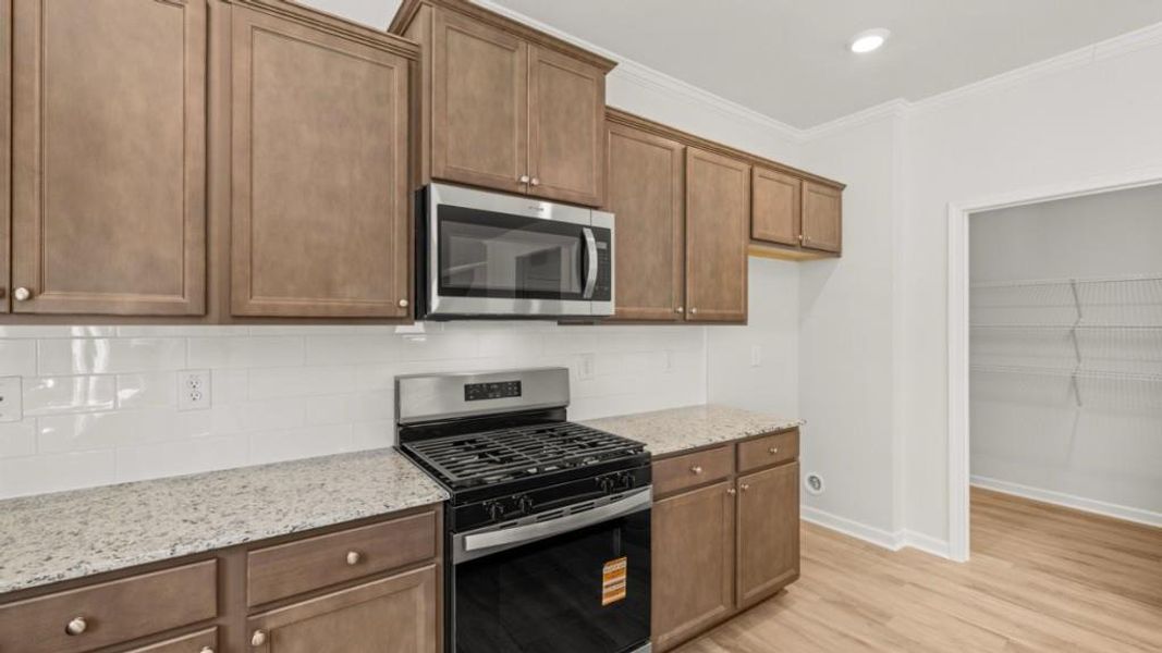 Furnished interior view inside a new home in Northwoods at Mirror Lake, Villa Rica (Image 8).