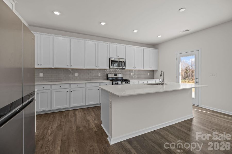 Furnished interior view inside a new home in McFarland Estates, York (Image 6).