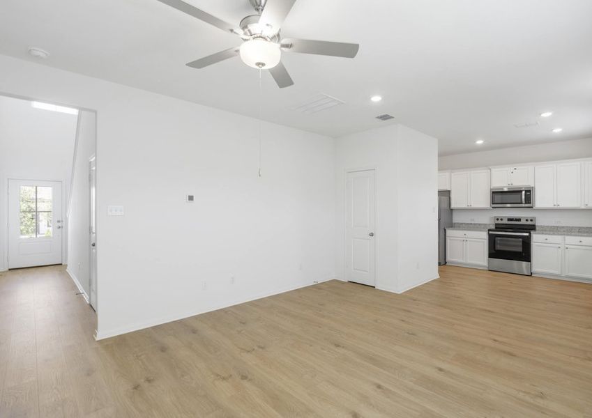 Spacious family room with vinyl flooring