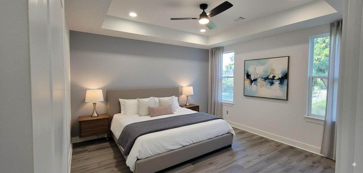 Primary bedroom suite with 10ft high coffered ceiling.