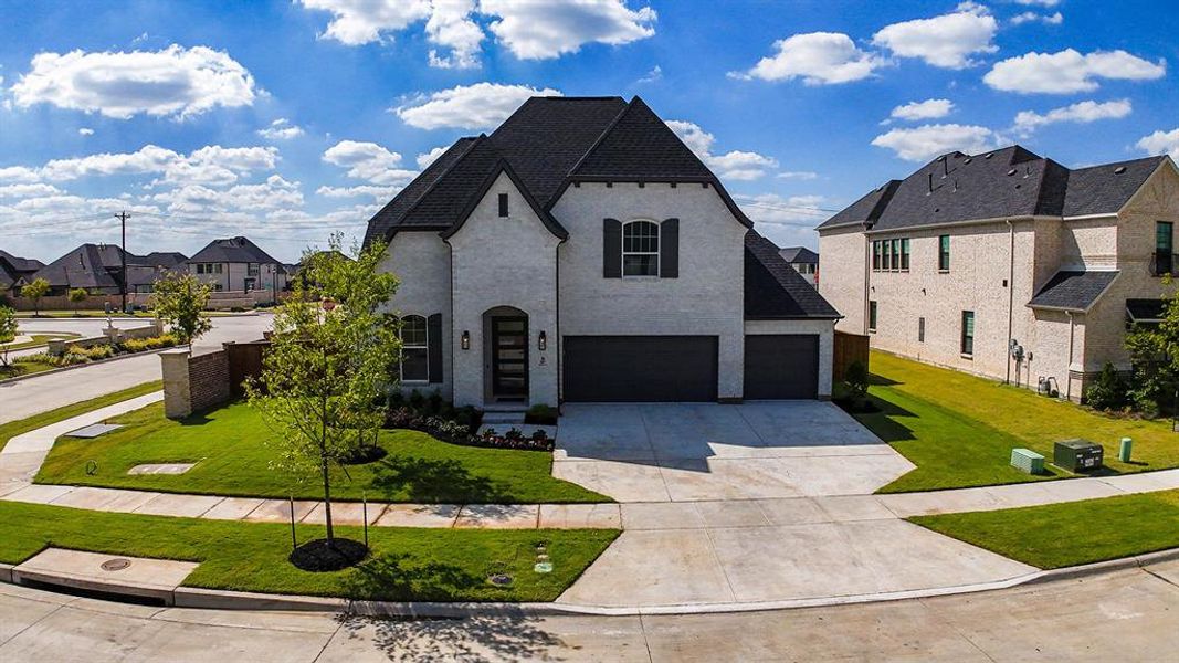 Front exterior of a new home in Estates at Rockhill, Frisco, TX, highlighting curb appeal (Image 23).