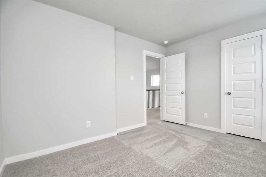 Generously sized secondary bedrooms, complete with spacious closets and soft, inviting carpeting. Enjoy abundant natural light streaming in through the large windows, complemented by privacy blinds for your personal sanctuary.