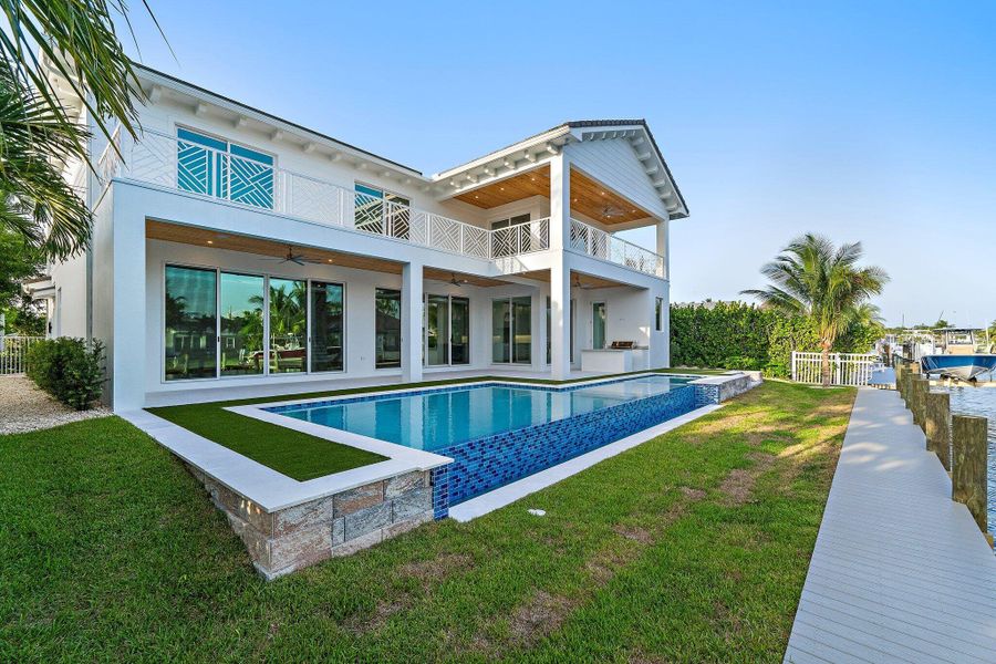 Front exterior of a new home in , Tequesta, FL, highlighting curb appeal (Image 43). Front exterior of a new home in , Tequesta, FL, highlighting curb appeal (Image 43).